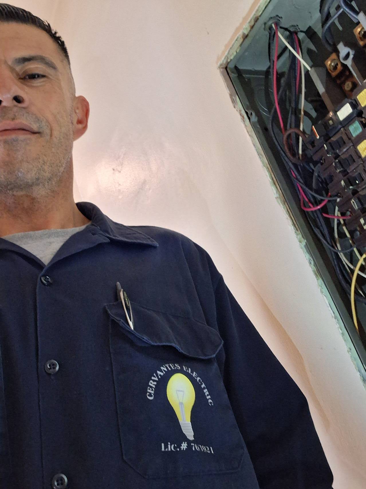 Cervantes Electric electrician working an open residential panel